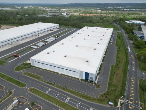 Aerial view of two large white industrial warehouse buildings and parking. | Down To Earth Landscaping | Jackson New Jersey, USA (732) 833-7702