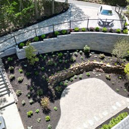 Modern terraced backyard design with retaining walls and paved Hardscapes. | Down To Earth Landscaping | Jackson New Jersey, USA (732) 833-7702
