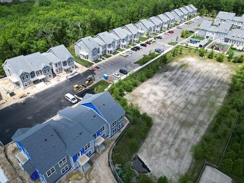 Aerial view of new gray townhouse construction in a developing residential neighborhood. | Down To Earth Landscaping | Jackson New Jersey, USA (732) 833-7702