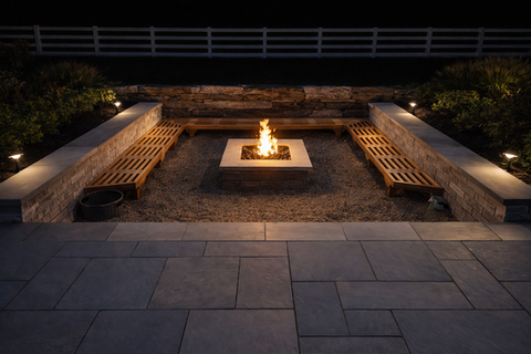 Modern outdoor fire pit with benches, glowing brightly at night. Residential landscaping near me| Down To Earth Landscaping | Jackson New Jersey, USA (732) 833-7702