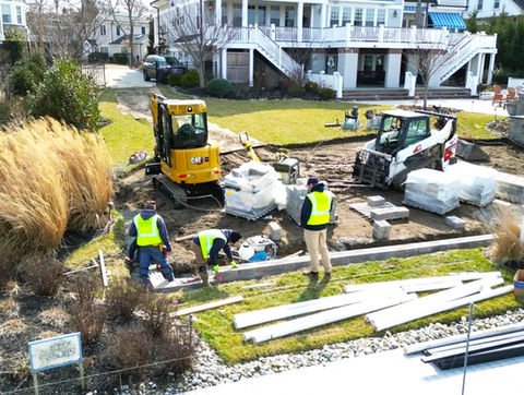Construction workers landscaping a residential property with heavy machinery. Residential landscaping near me| Down To Earth Landscaping | Jackson New Jersey, USA (732) 833-7702