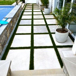 Modern patio walkway with square pavers and artificial turf strips. | Down To Earth Landscaping | Jackson New Jersey, USA (732) 833-7702